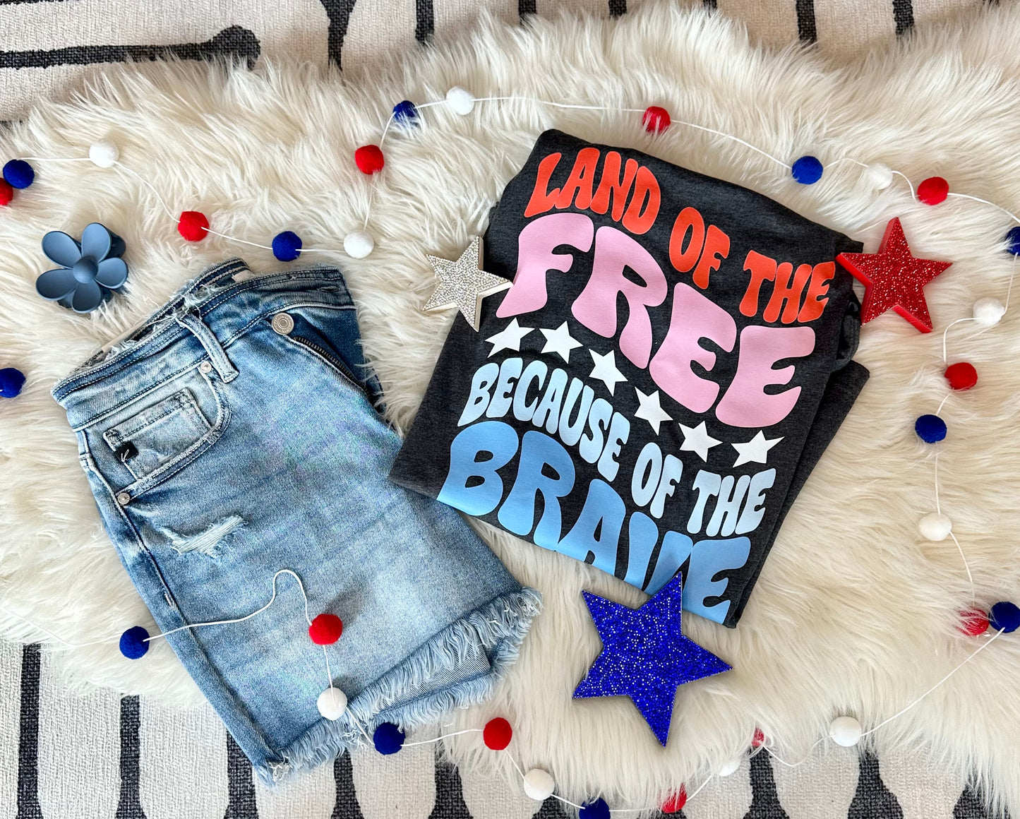 Land of the Free because of the Brave Charcoal Bella Tee