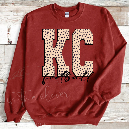 Neutral KC Football on Heather Red Crewneck